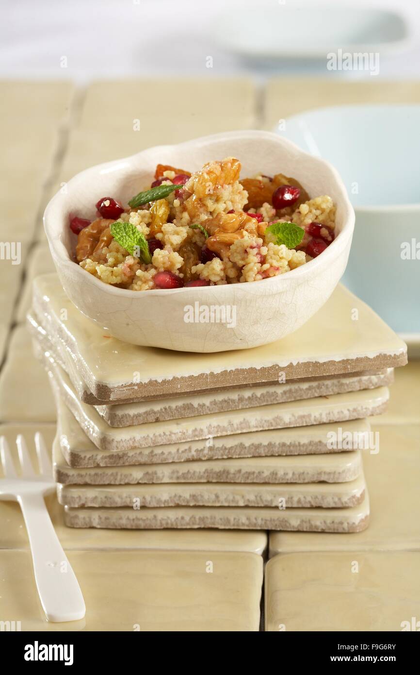 Masfouf (sweet couscous with walnuts and pomegranate) Stock Photo