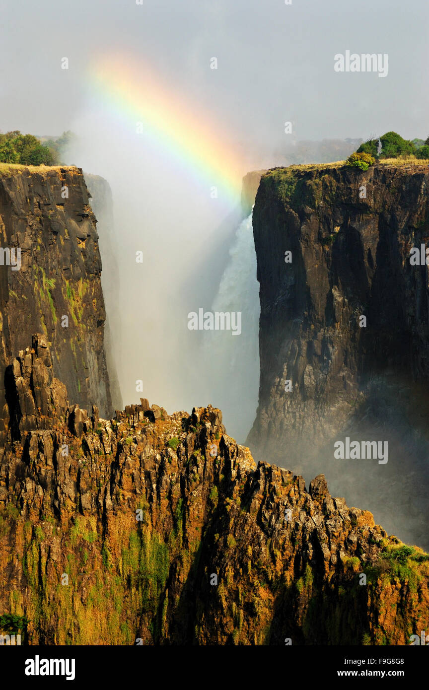 Rainbow over the Victoria Falls during dry season (September) from the Zambian side, Zambia Stock Photo