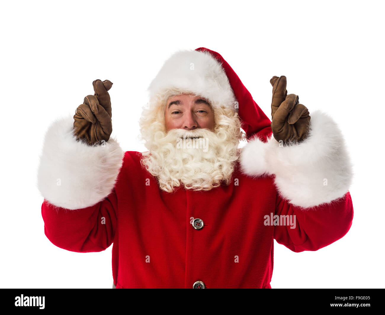 Santa Claus holding fingers crossed for good luck Closeup Portrait ...