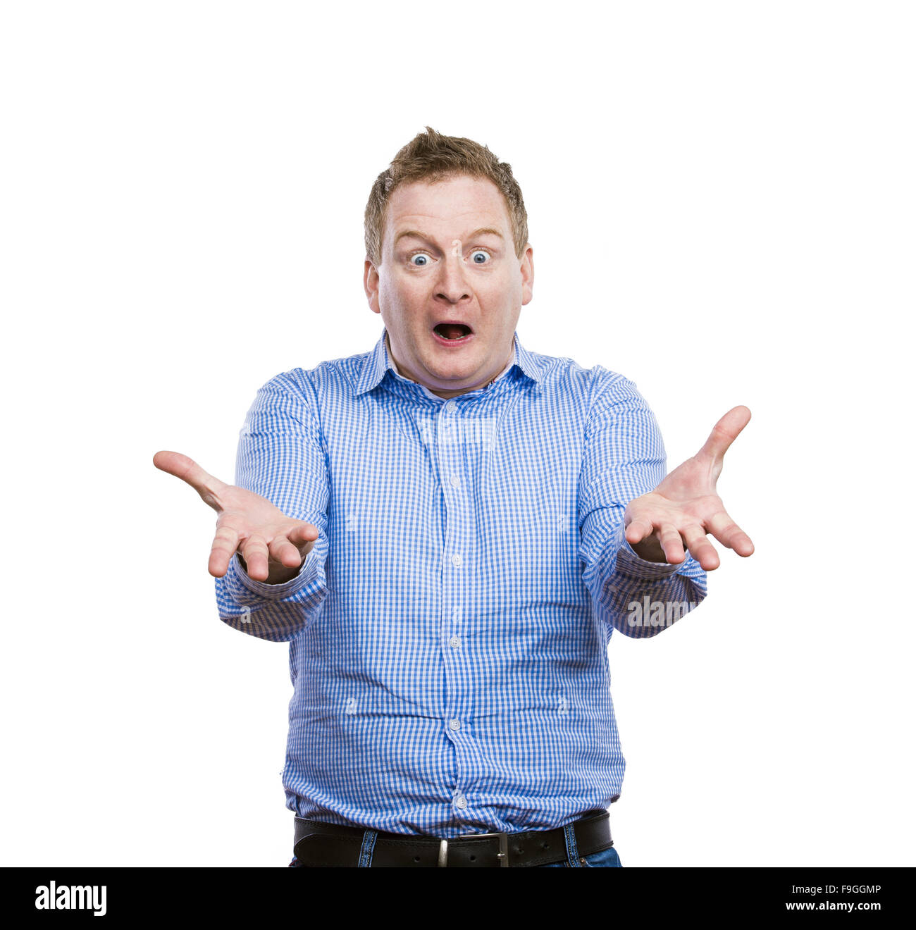 Funny young adult showing his emotions expressively by his gestures and mimics . Studio shot on white background. Stock Photo