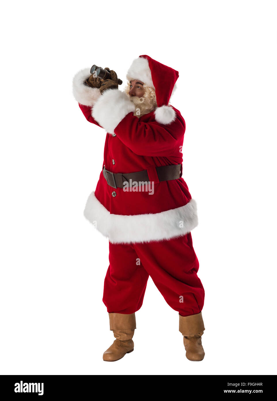 Santa Claus looking through binoculars Full-Length Portrait Stock Photo