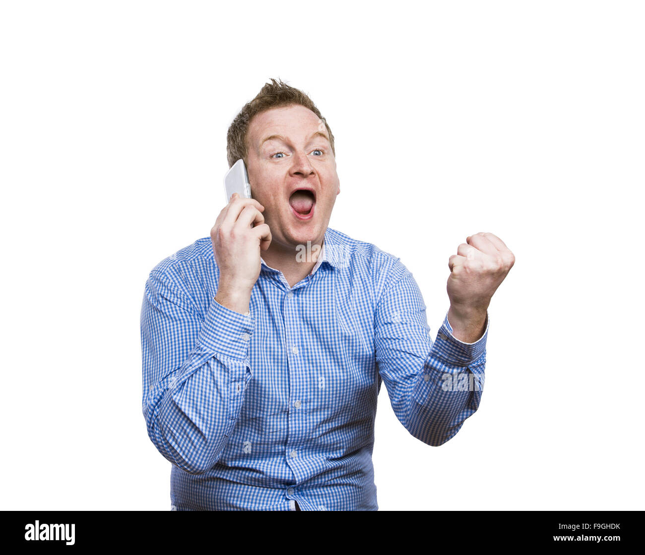 Man making funny faces while making a phone call. Studio shot on white