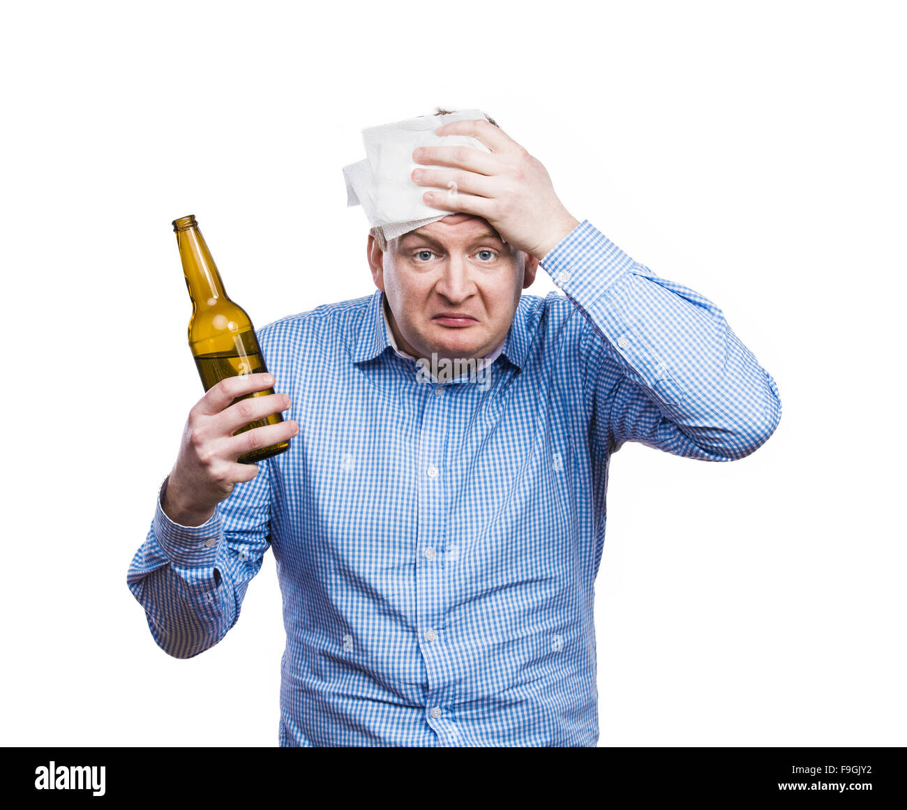 Funny young drunk man holding a beer bottle. Studio shot on white ...