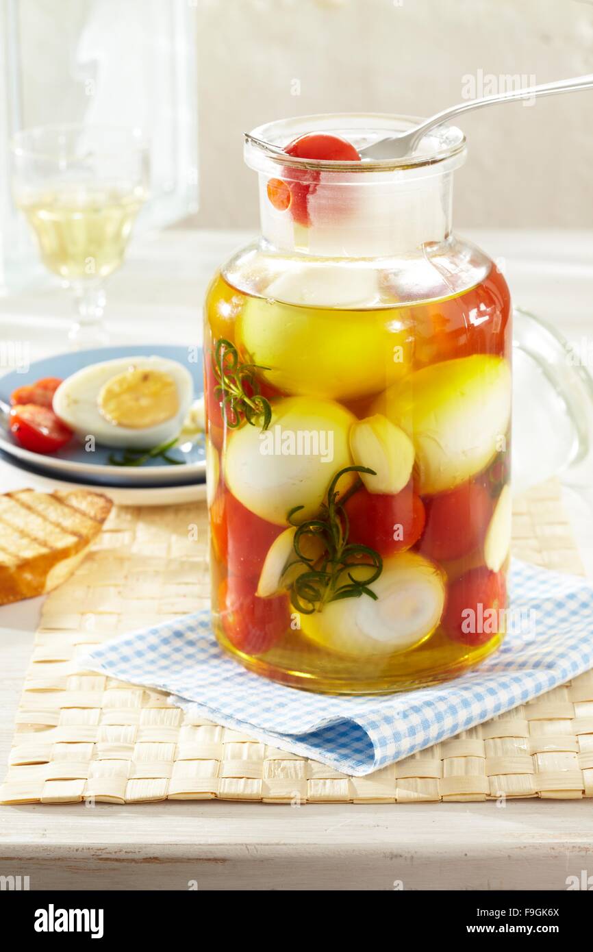 Pickled Eggs in Herb Oil Stock Photo Alamy