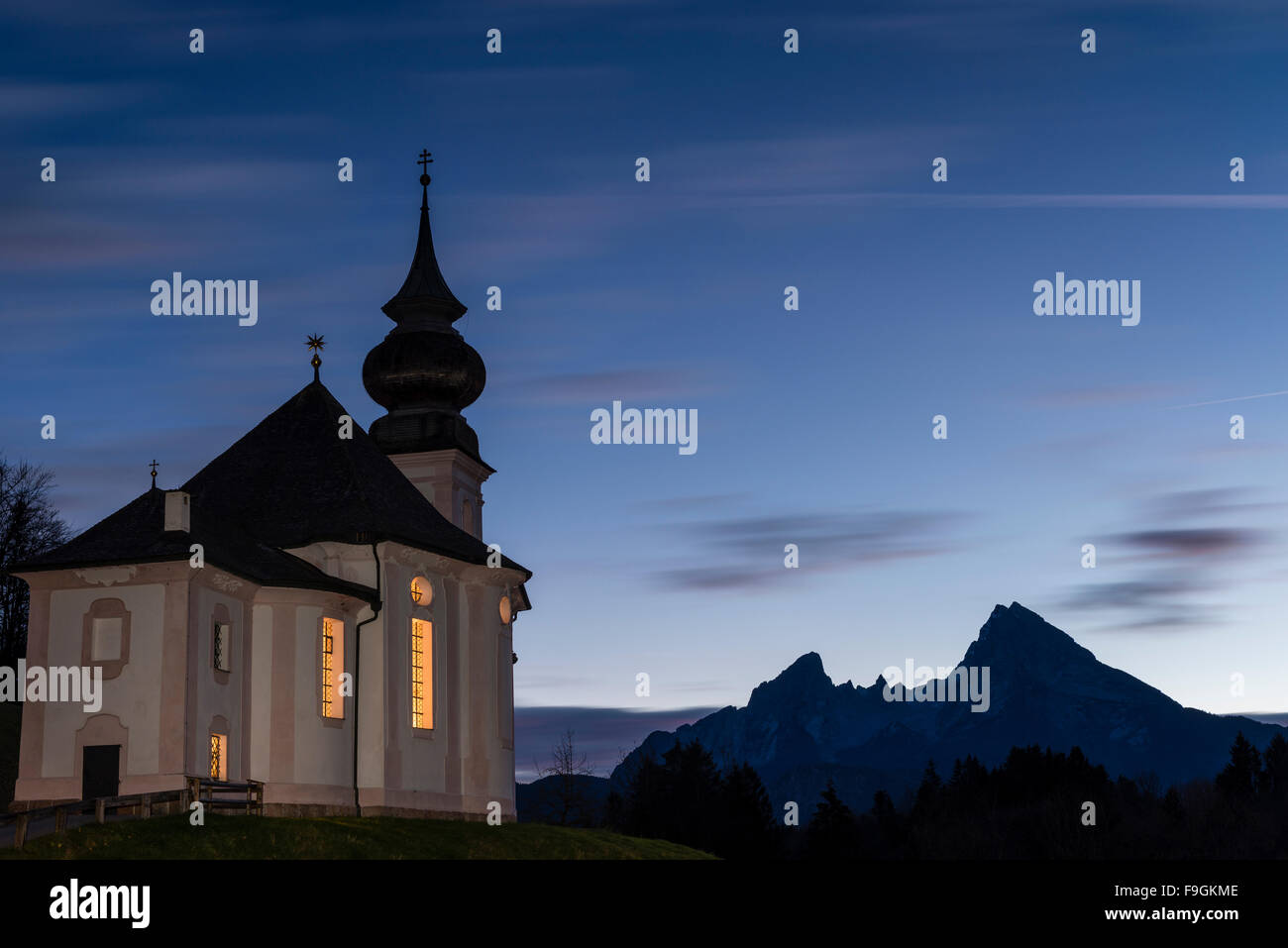 Pilgrimage church Maria Gern at dusk, Mount Watzmann behind, Berchtesgaden, Bavaria, Germany Stock Photo