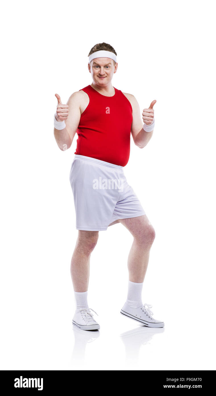Funny weak sportsman exercising. Studio shot on white background. Stock Photo