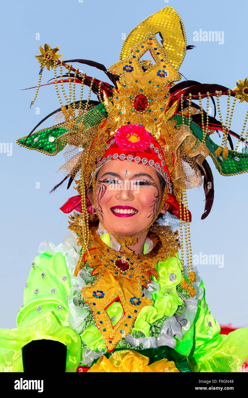 Woman with headdress and costume, National Day parade, Klaten, Central Java, Java Island, Indonesia Stock Photo
