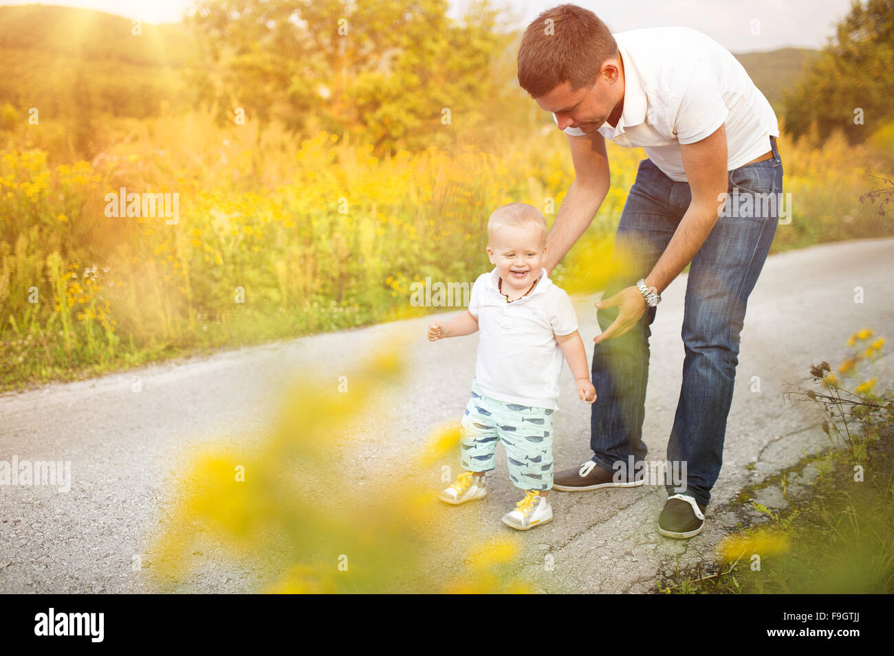 Father and son on a walk in nature enjoying life together. Stock Photo