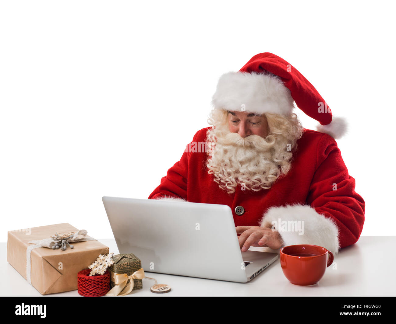 Santa Claus reading children letters and writing responses to them ...