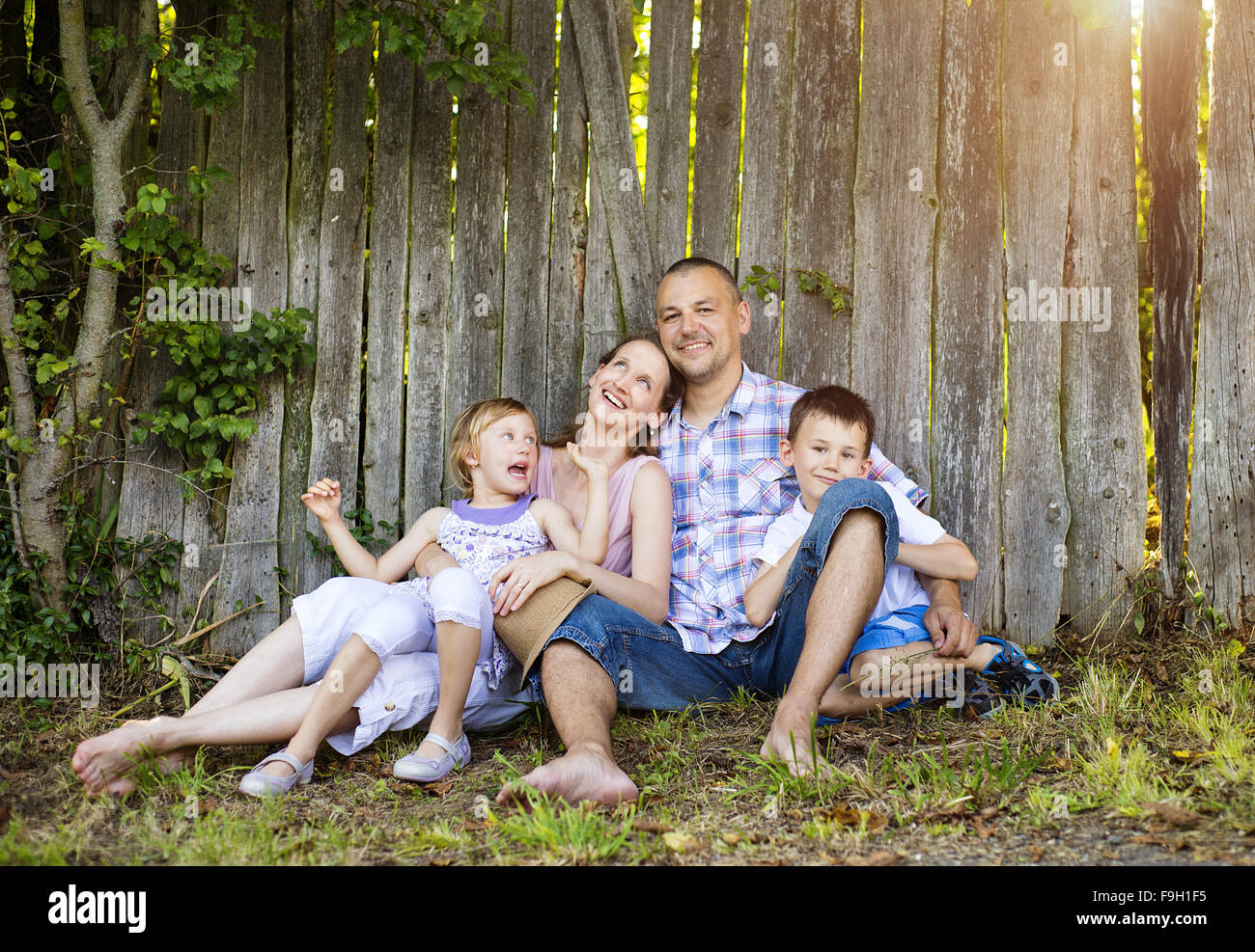 Happy young family spending time together outside in nature. Stock Photo