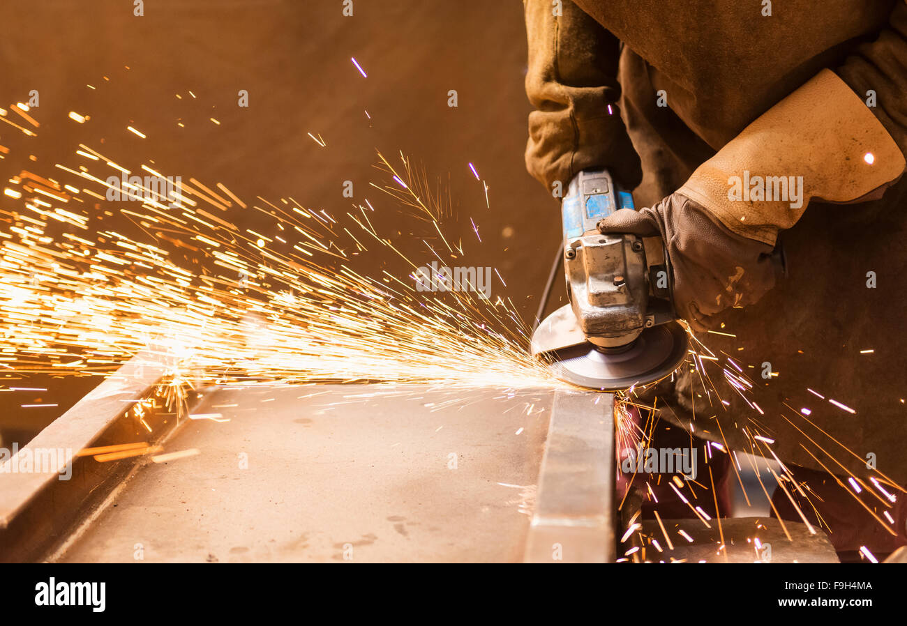 Close up of unrecognizable young man welding in a factory Stock Photo