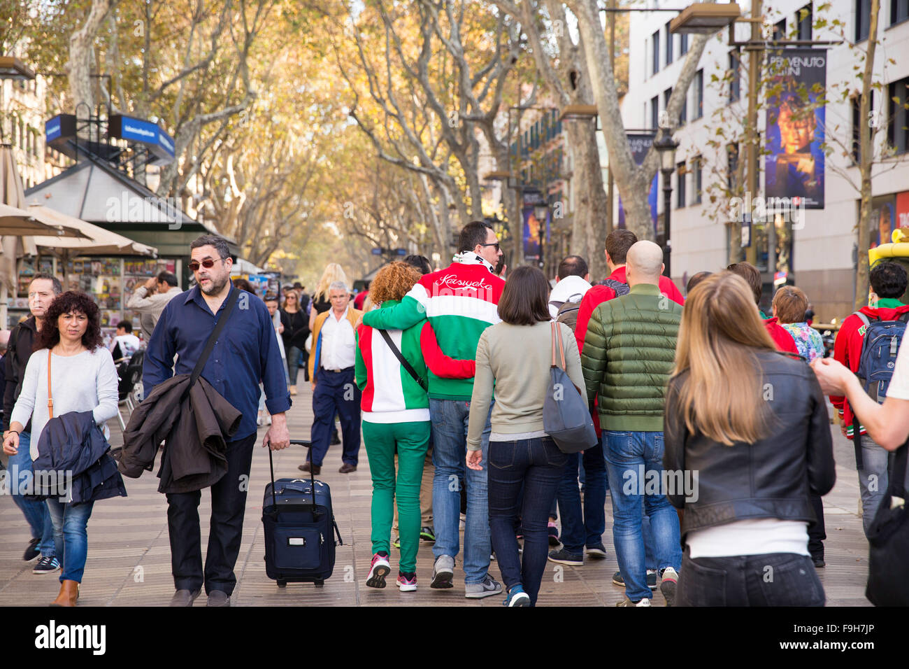 People walking on la Rambla street. La Rambla is a street in central Barcelona Stock Photo