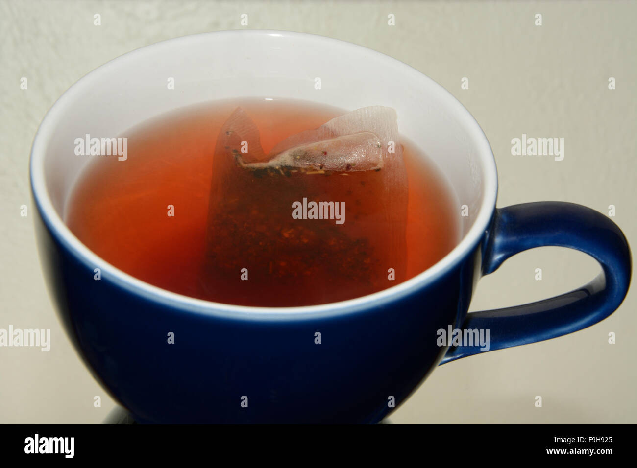 Cup of herbal tea with teabag steeping in coffee up Stock Photo Alamy