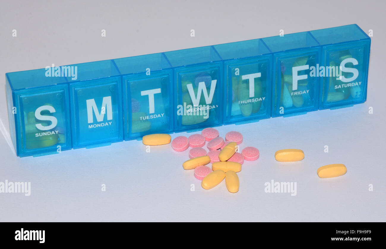Blue Daily pill reminder dispenser with days of week compartments Stock ...