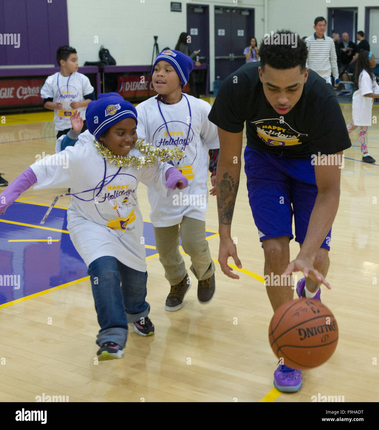 Los Angeles, USA. 16th Dec, 2015. D'Angelo Russell of Lakers plays  basketball with kids during a party hosted by the Los Angeles Lakers for 60  homeless kids at Toyota Sports Center in