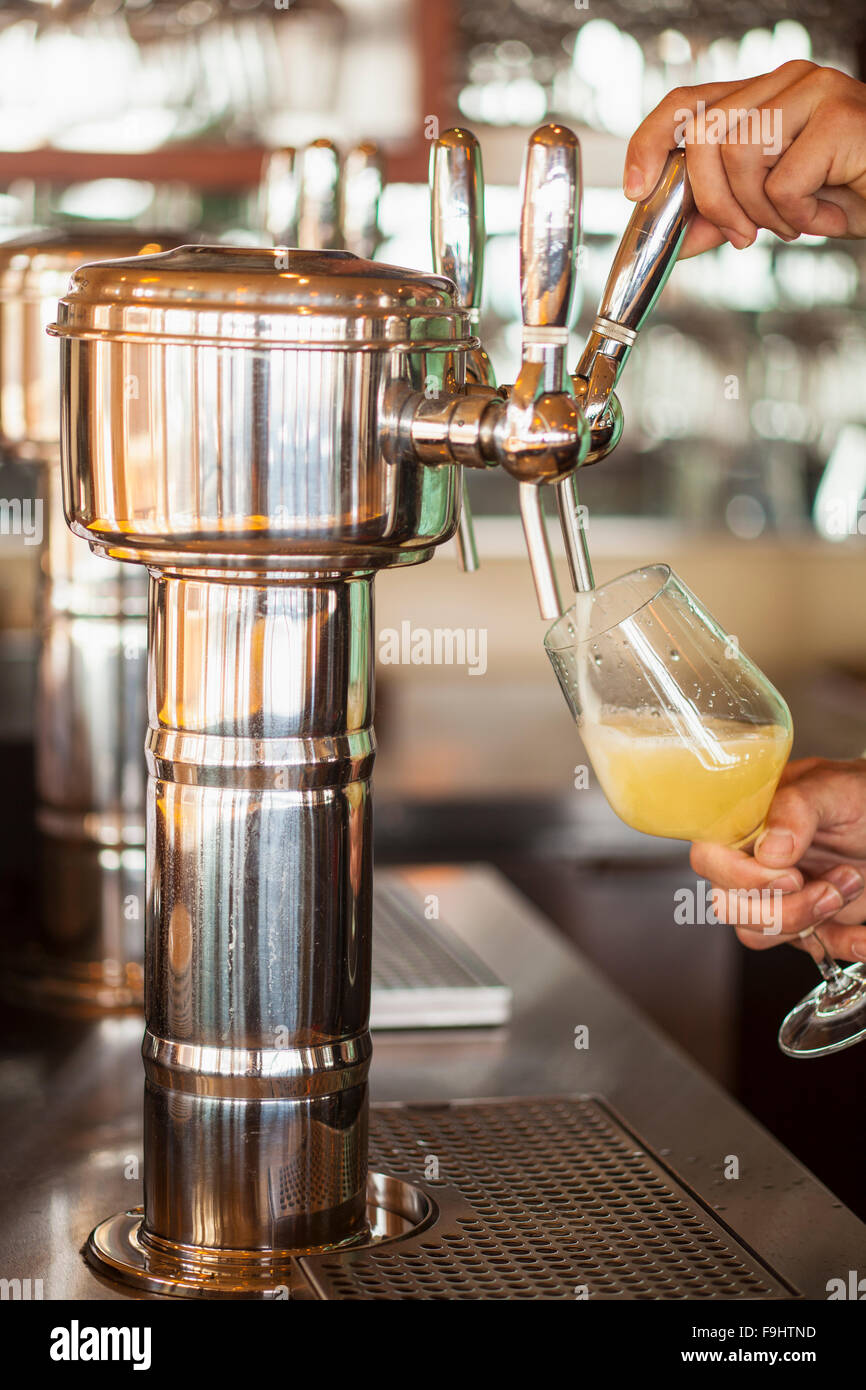 chardonnay wine is poured from a bar tap, Ocean Grill, Avila Beach, California Stock Photo