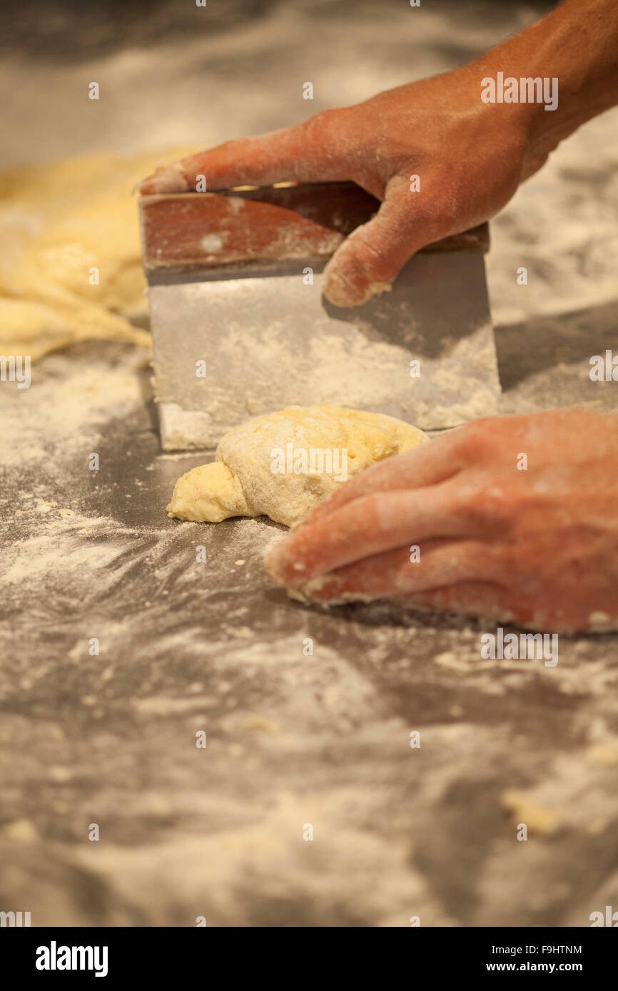 chef  and owner Julian Martinez makes hamburger buns, Barbareno Restaurant, Santa Barbara, California Stock Photo