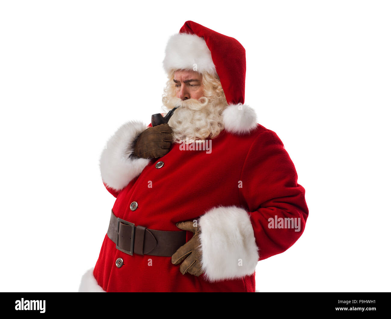 Santa Claus smoking pipe Closeup Portrait. Isolated on White Background Stock Photo