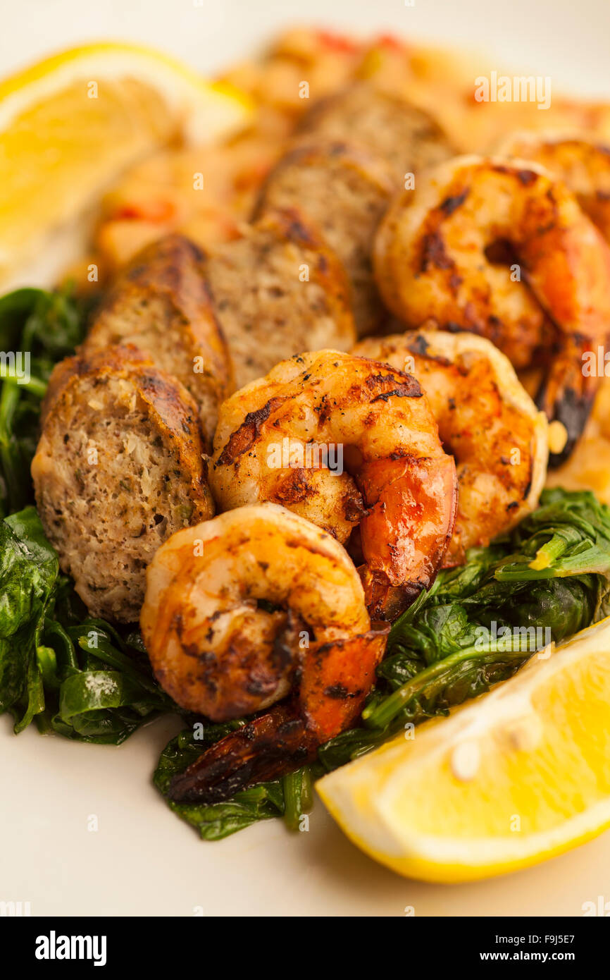 grilled shrimp and chicken sausage with white beans and sauteed baby spinach, Paradise Cafe, Santa Barbara, California Stock Photo