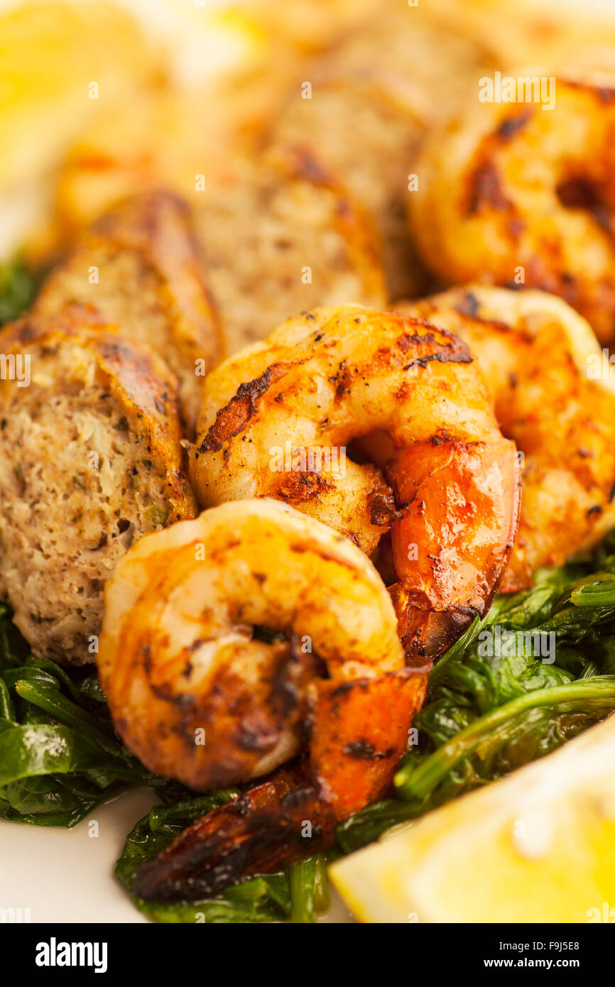 grilled shrimp and chicken sausage with white beans and sauteed baby spinach, Paradise Cafe, Santa Barbara, California Stock Photo