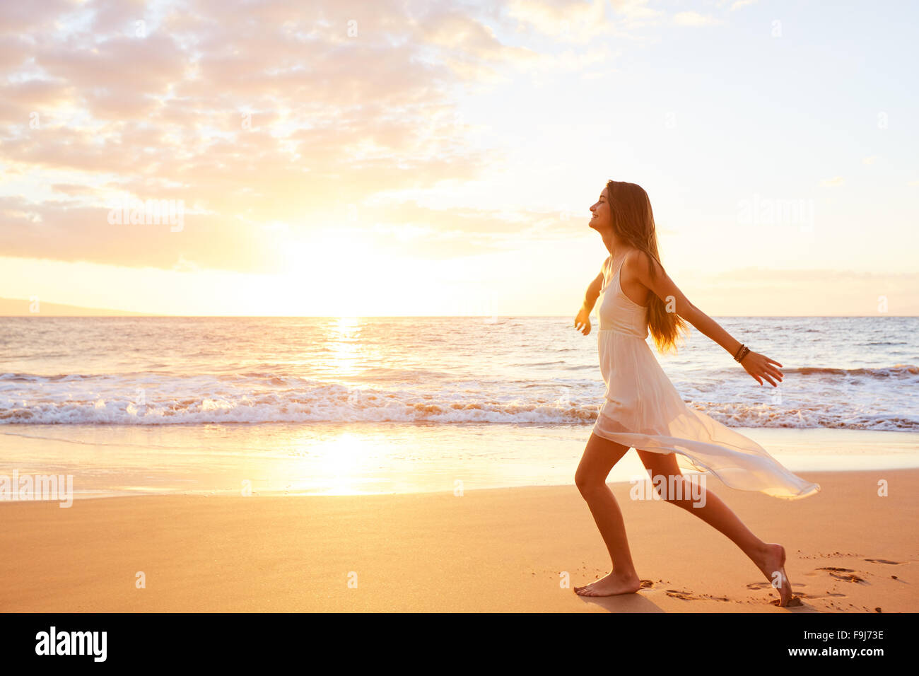 Beautiful woman dancing beach hi-res stock photography and images - Alamy