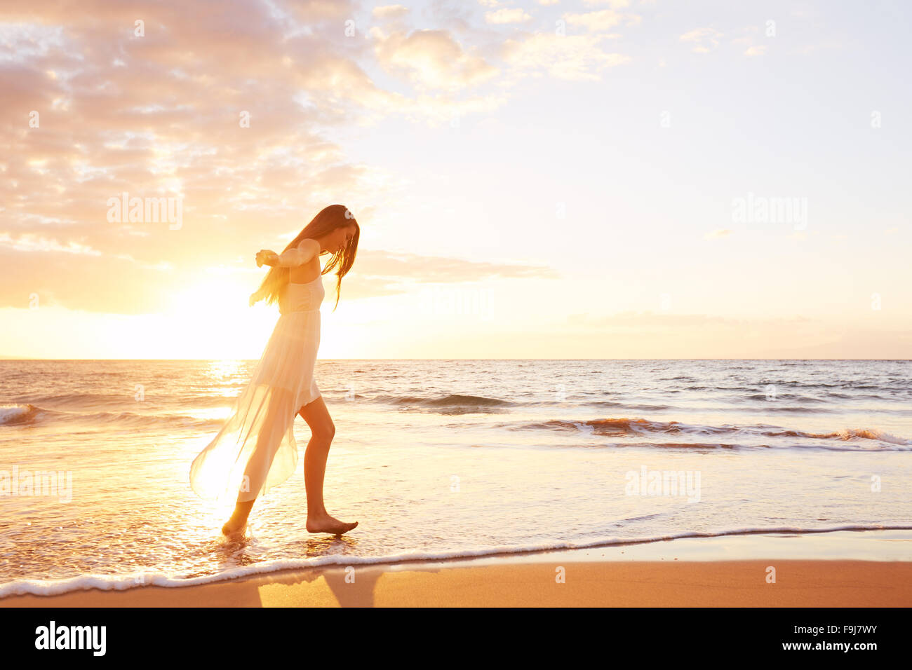 Beautiful woman dancing beach hi-res stock photography and images - Alamy