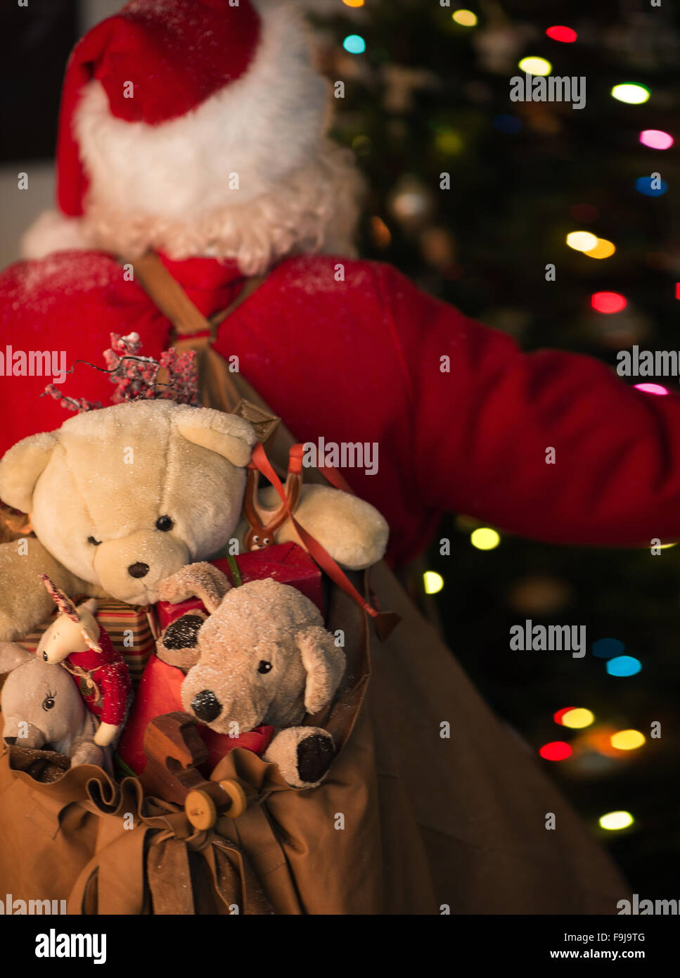 Santa claus holding bag toys hi-res stock photography and images - Alamy