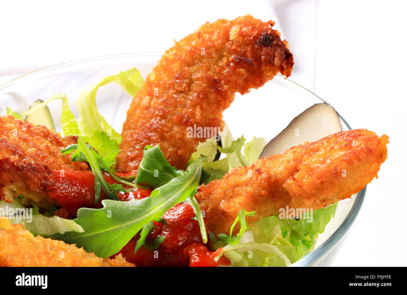 Crispy chicken tenders with salad Stock Photo Alamy