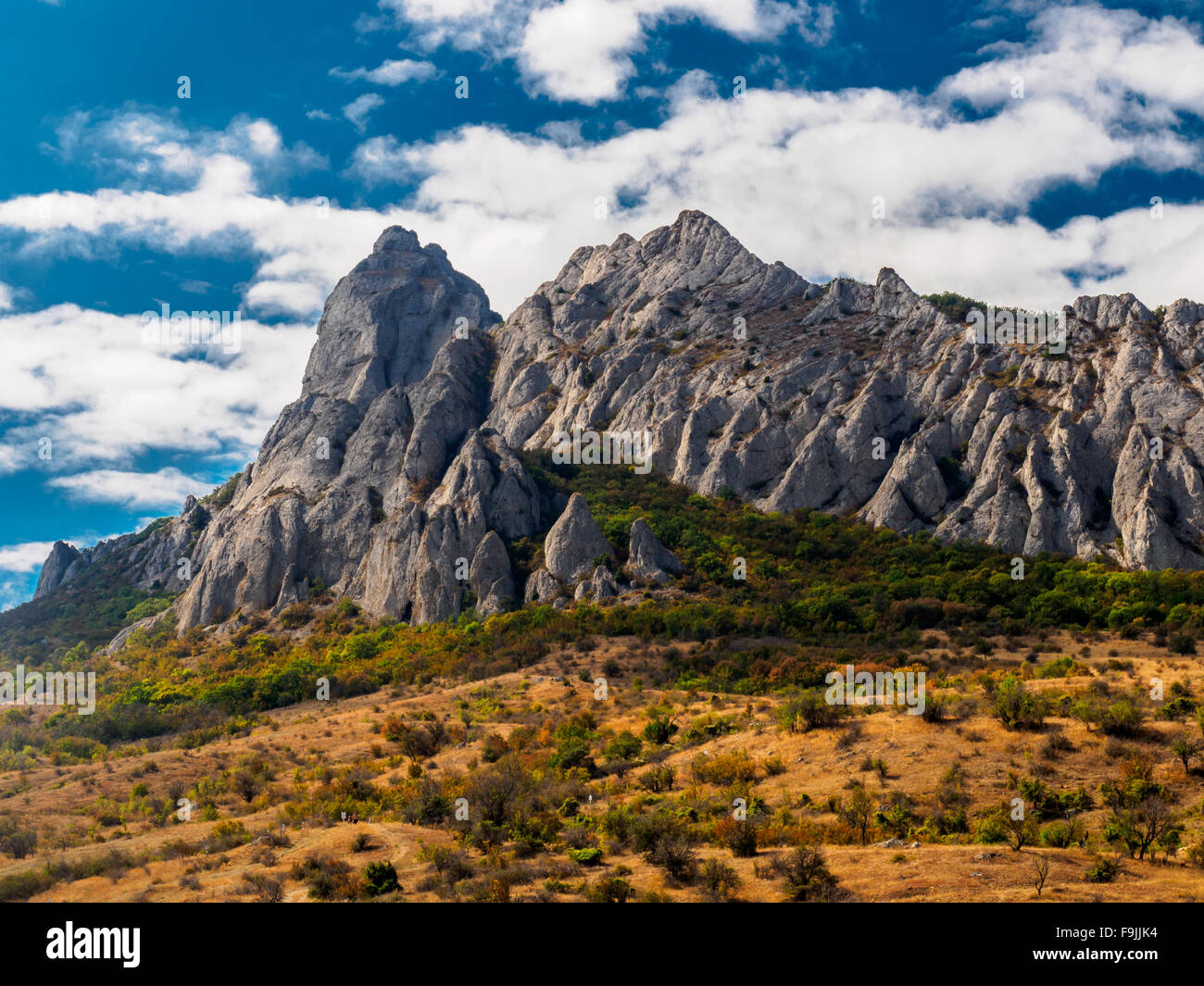 White rocks against the blue sky with white clouds Stock Photo - Alamy