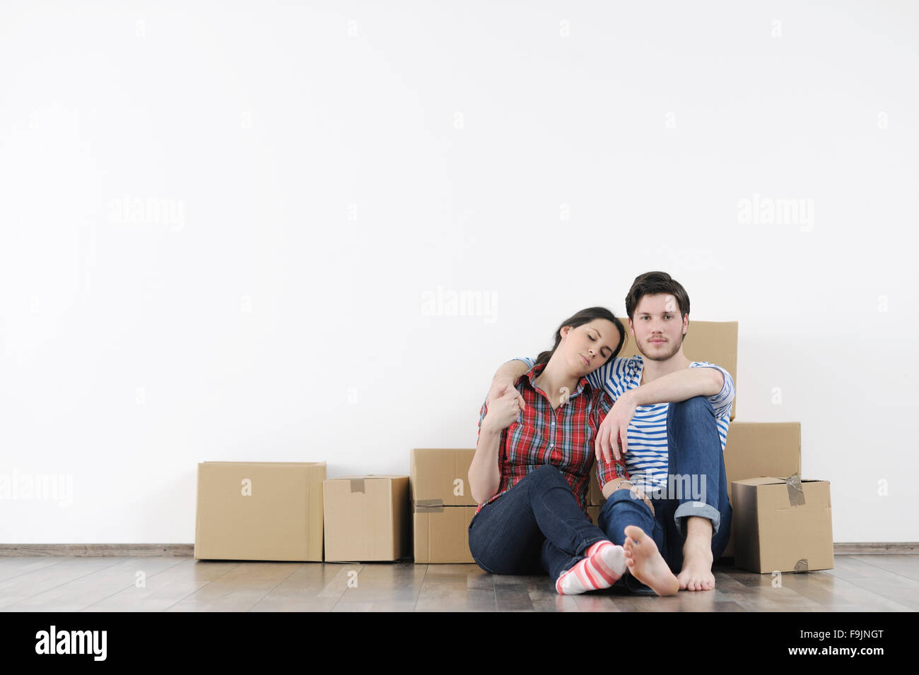 happy Young couple moving in new home Stock Photo - Alamy