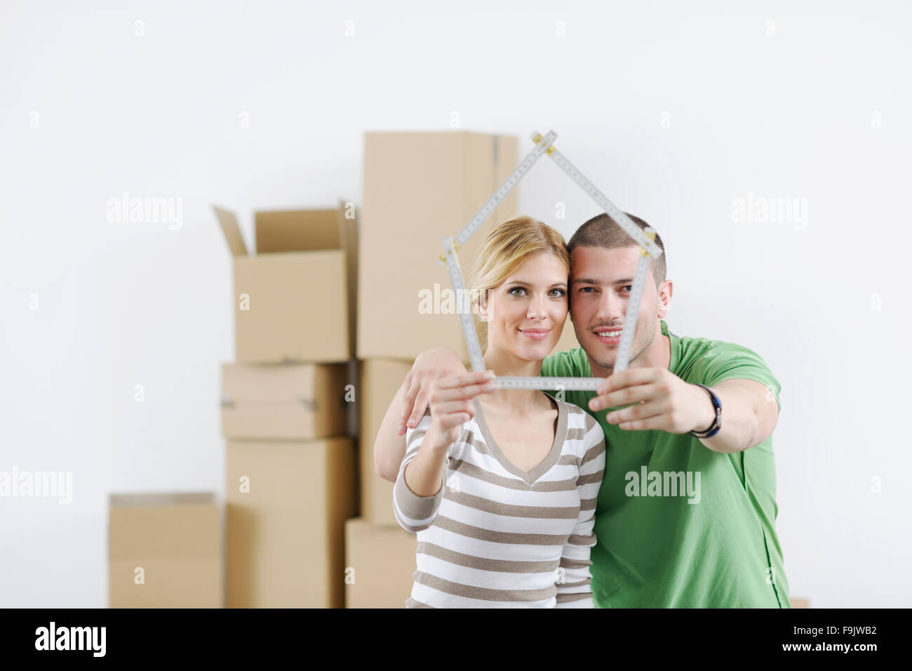 happy Young couple moving in new home Stock Photo - Alamy