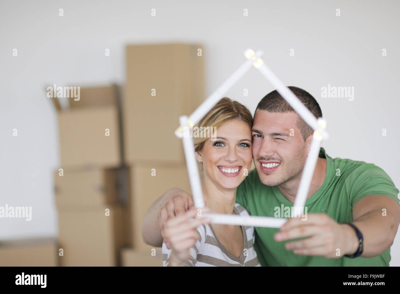 happy Young couple moving in new home Stock Photo - Alamy