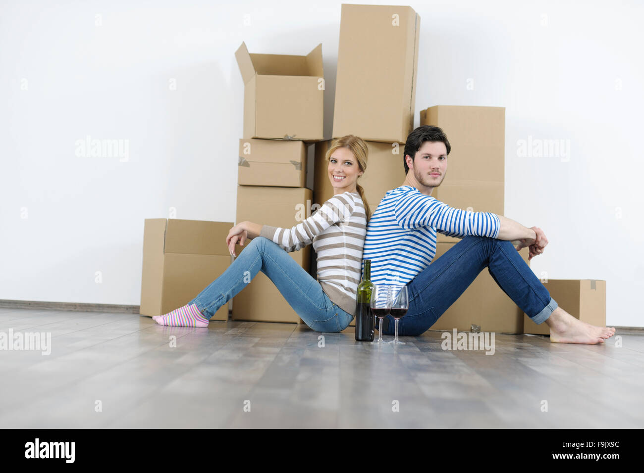 happy Young couple moving in new home Stock Photo - Alamy