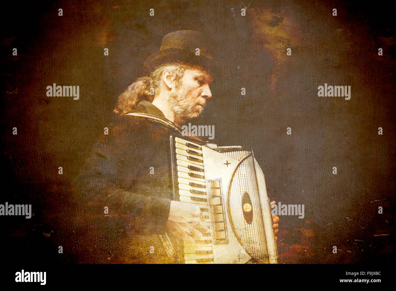 Gypsy accordion player processed with textures for a vintage grunge look. Stock Photo
