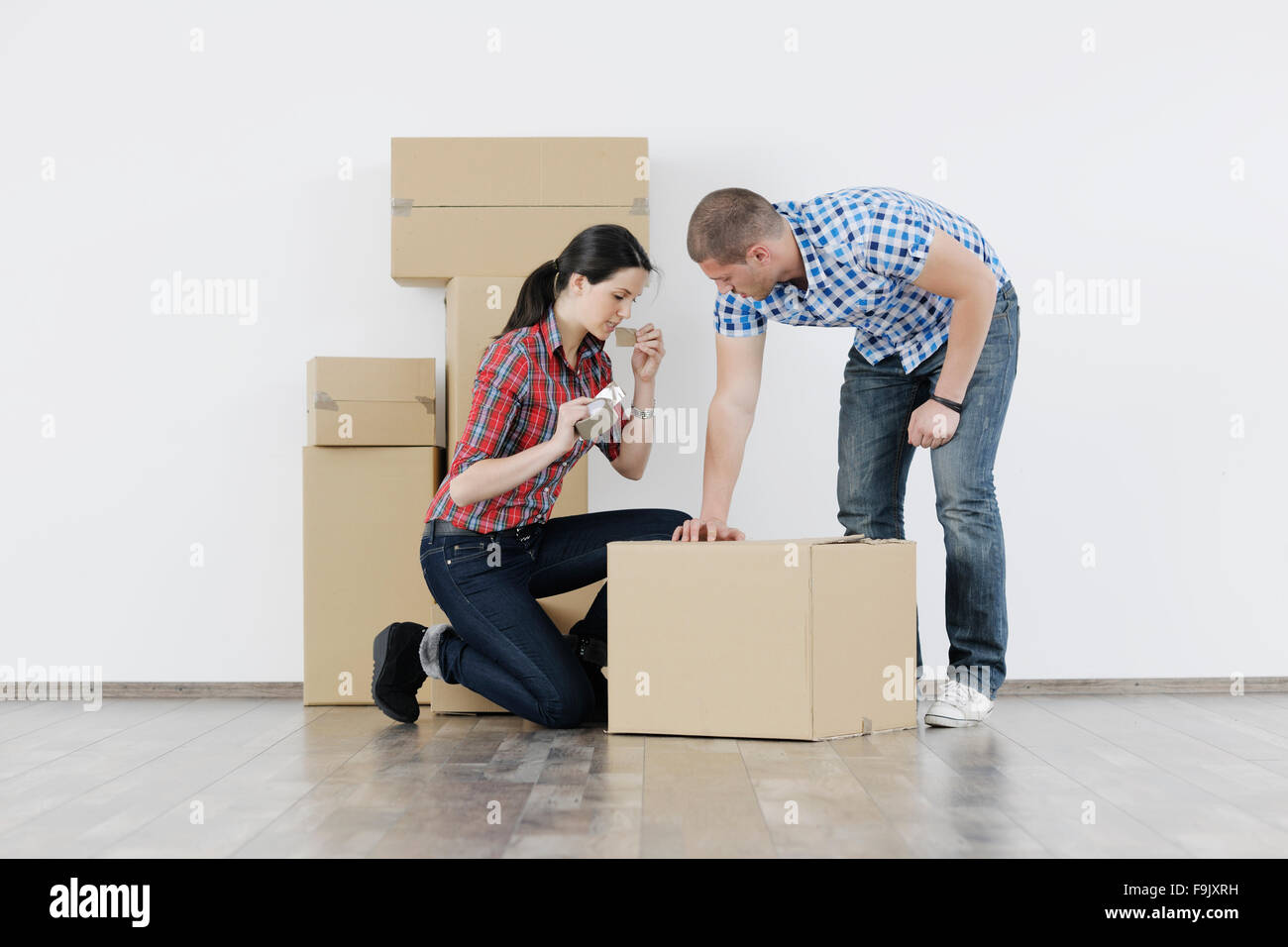 happy Young couple moving in new home Stock Photo - Alamy