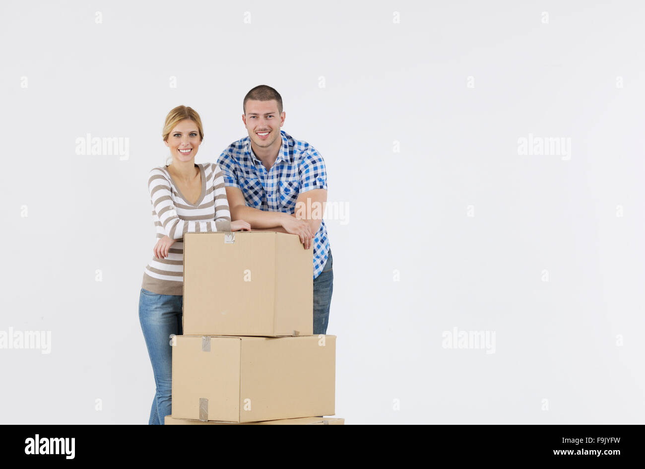 happy Young couple moving in new home Stock Photo - Alamy