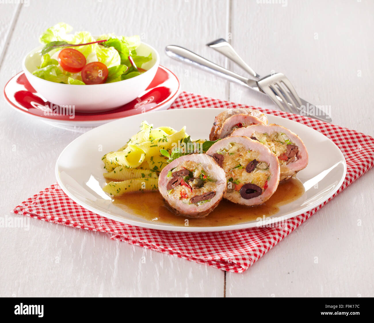 Olive stuffed pork roulade + steps Stock Photo Alamy