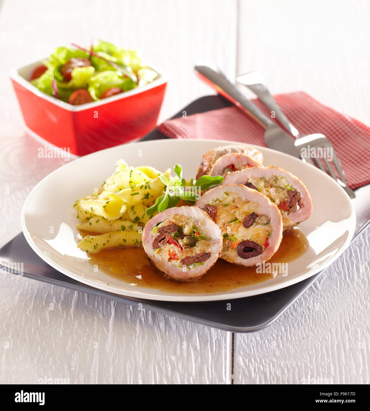 Olive stuffed pork roulade + steps Stock Photo Alamy