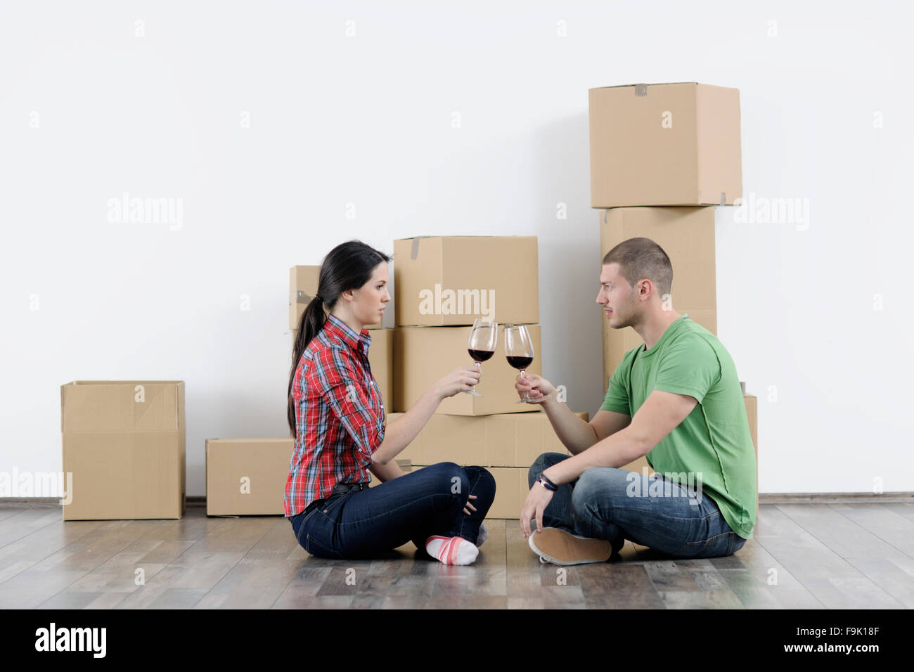 happy Young couple moving in new home Stock Photo - Alamy