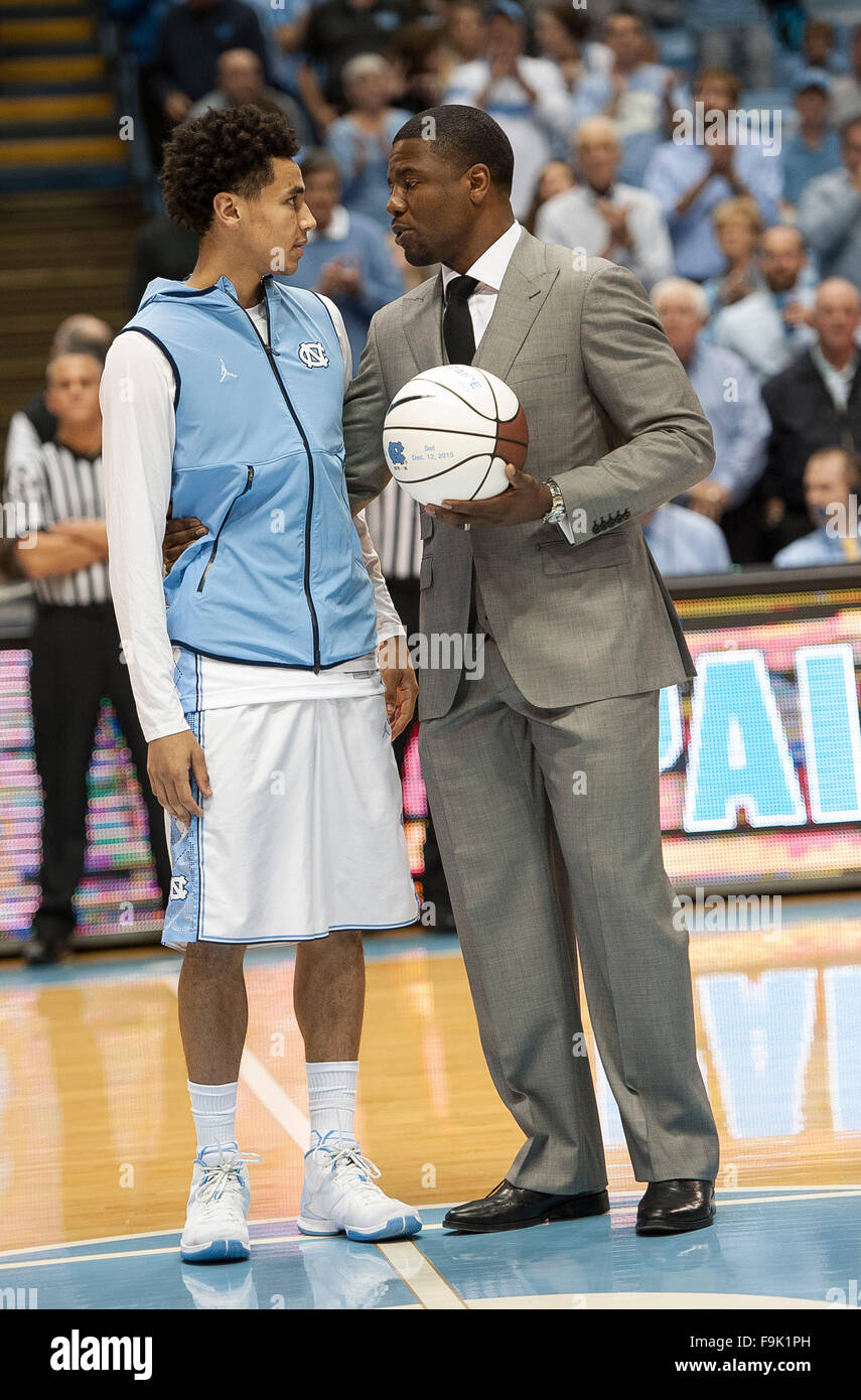 Dec. 16, 2015 - Chapel Hill, North Carolina; U.S. - Carolina Tarheels (5) MARCUS PAIGE is given an award by former Tarheel SHAMMOND WILLIAMS as the University of North Carolina Tarheels defeat the Tulane Green Wave with a final score of 96 - 72 as they played mens college basketball at the Dean Smith Center located in Chapel Hill. Copyright 2015 Jason Moore. © Jason Moore/ZUMA Wire/Alamy Live News Stock Photo