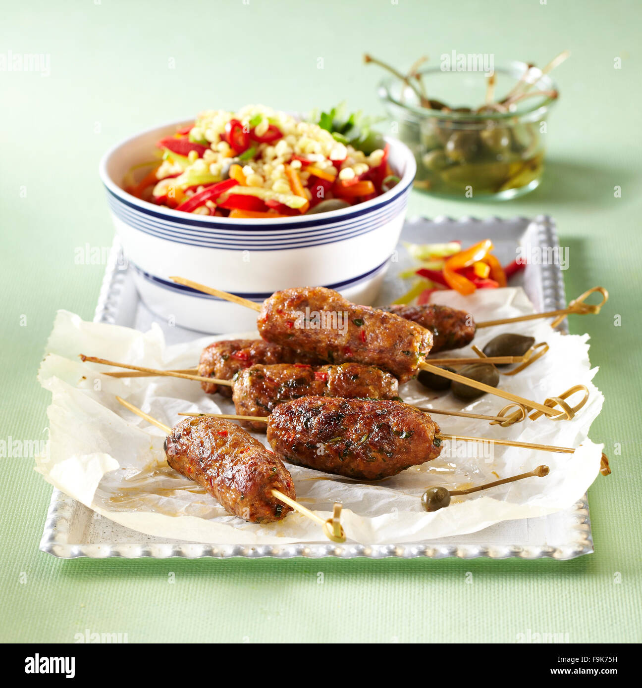 Minced meat skewers with pepper salad Stock Photo Alamy