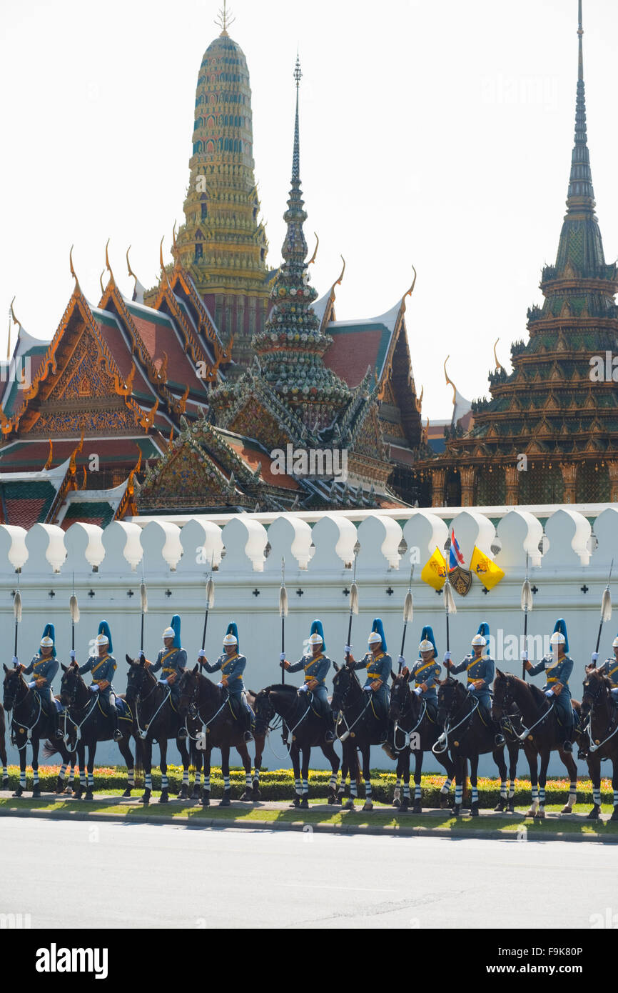 Row of lined up Royal Mounted Guard waiting for the King in front of the National Palace wall on the King's birthday parade Stock Photo