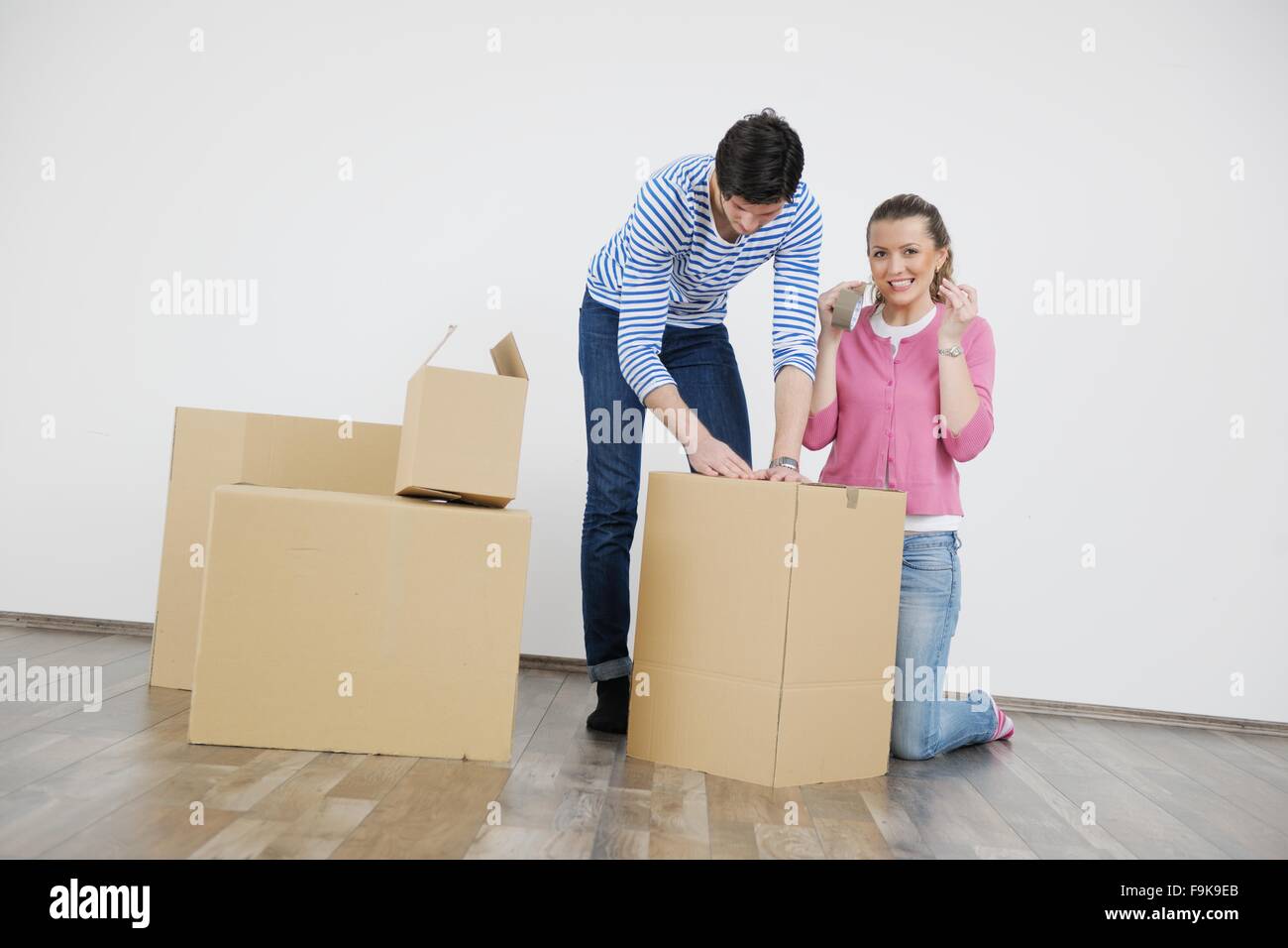 happy Young couple moving in new house Stock Photo - Alamy