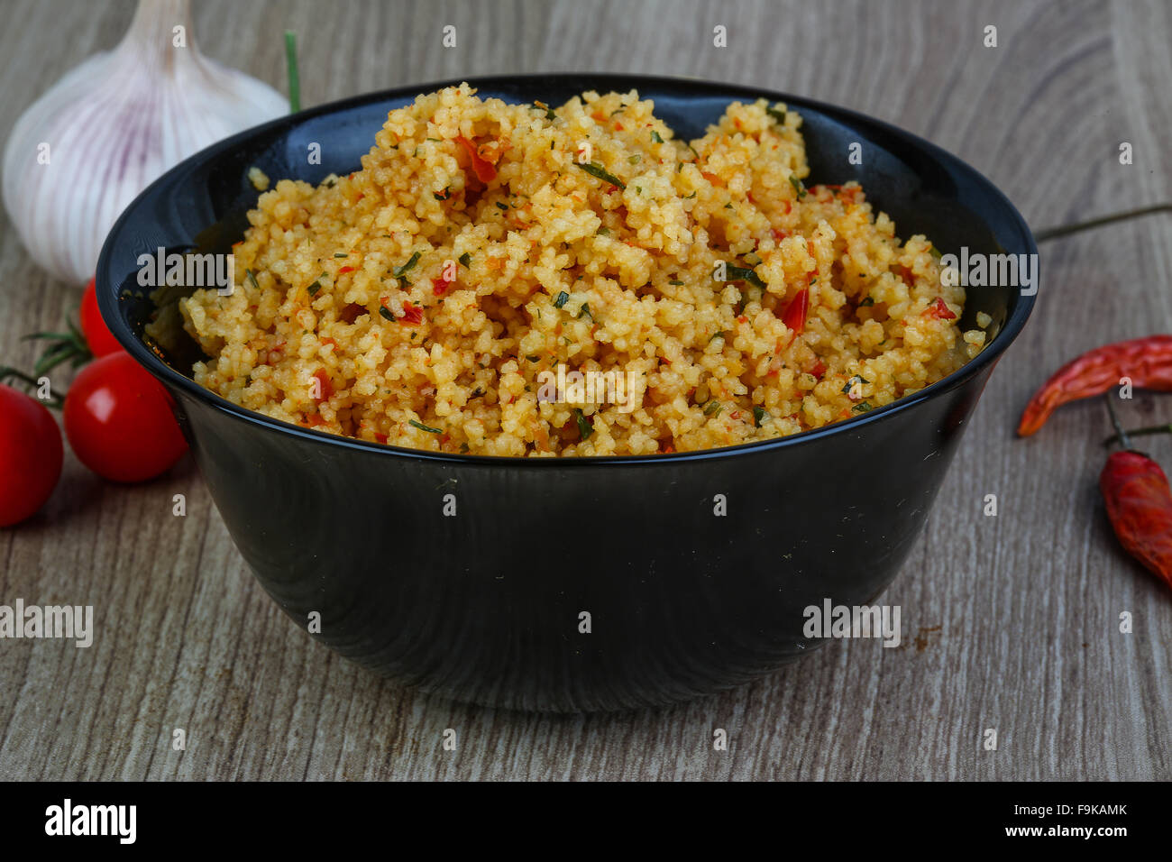 Arabic traditional cuisine Couscous with tomato and green onion Stock