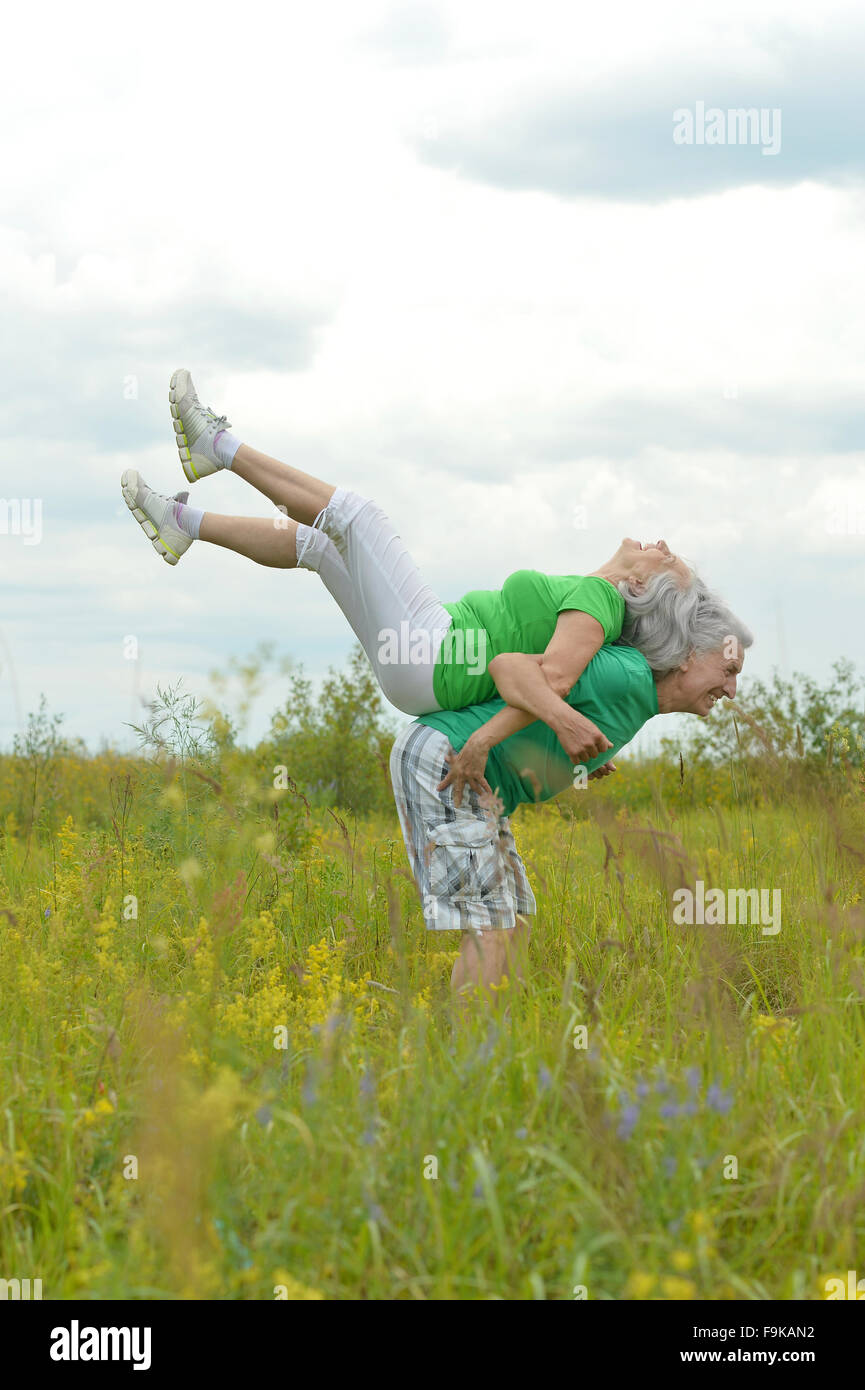 senior couple exercising in summer park Stock Photo - Alamy