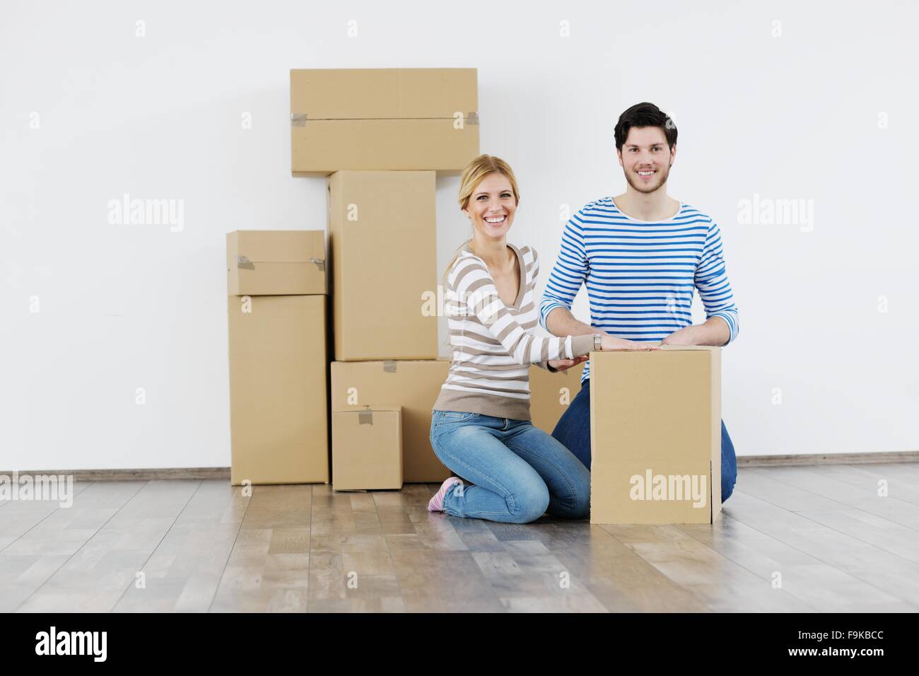 happy Young couple moving in new house Stock Photo - Alamy