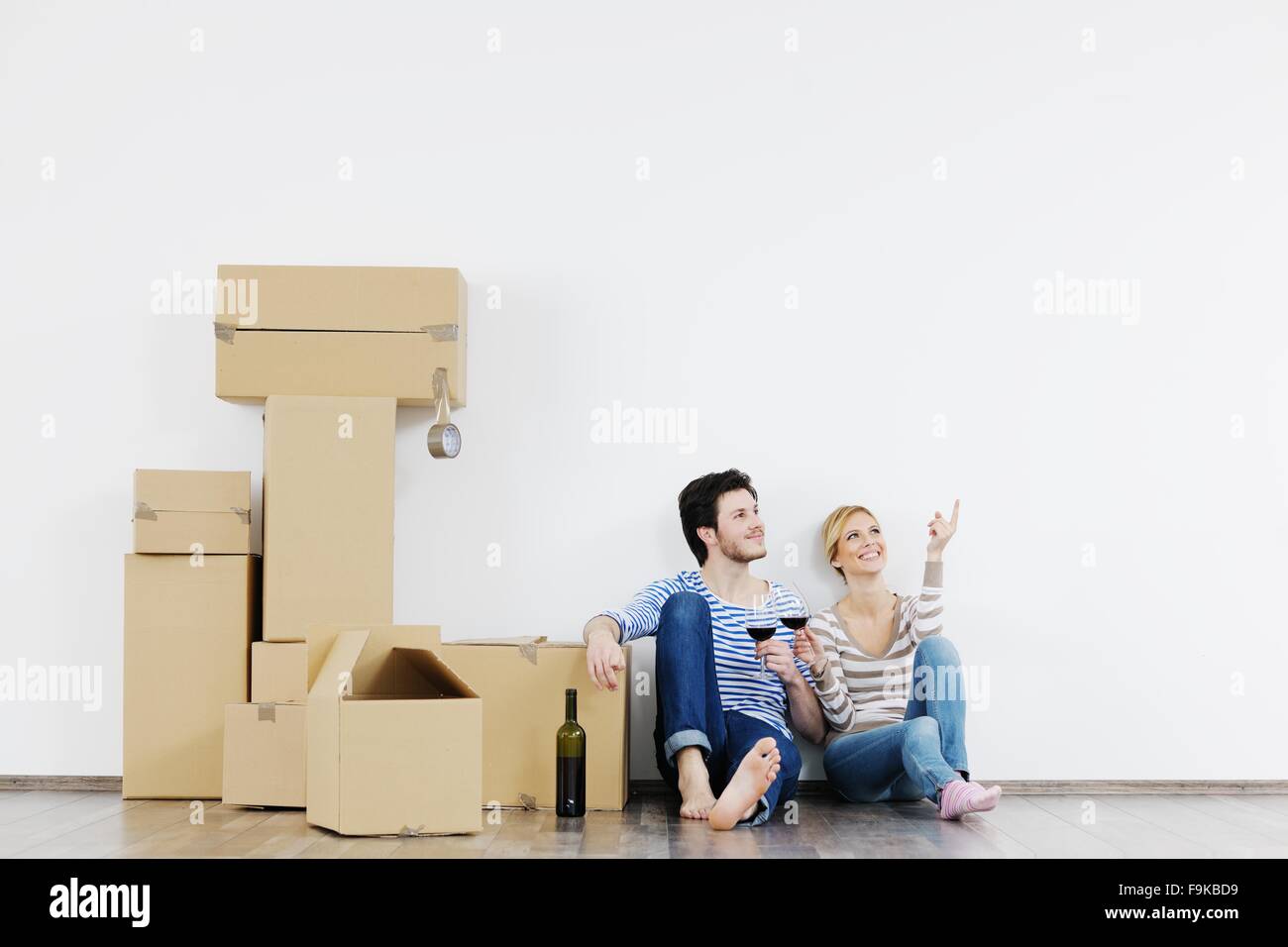 happy Young couple moving in new house Stock Photo - Alamy