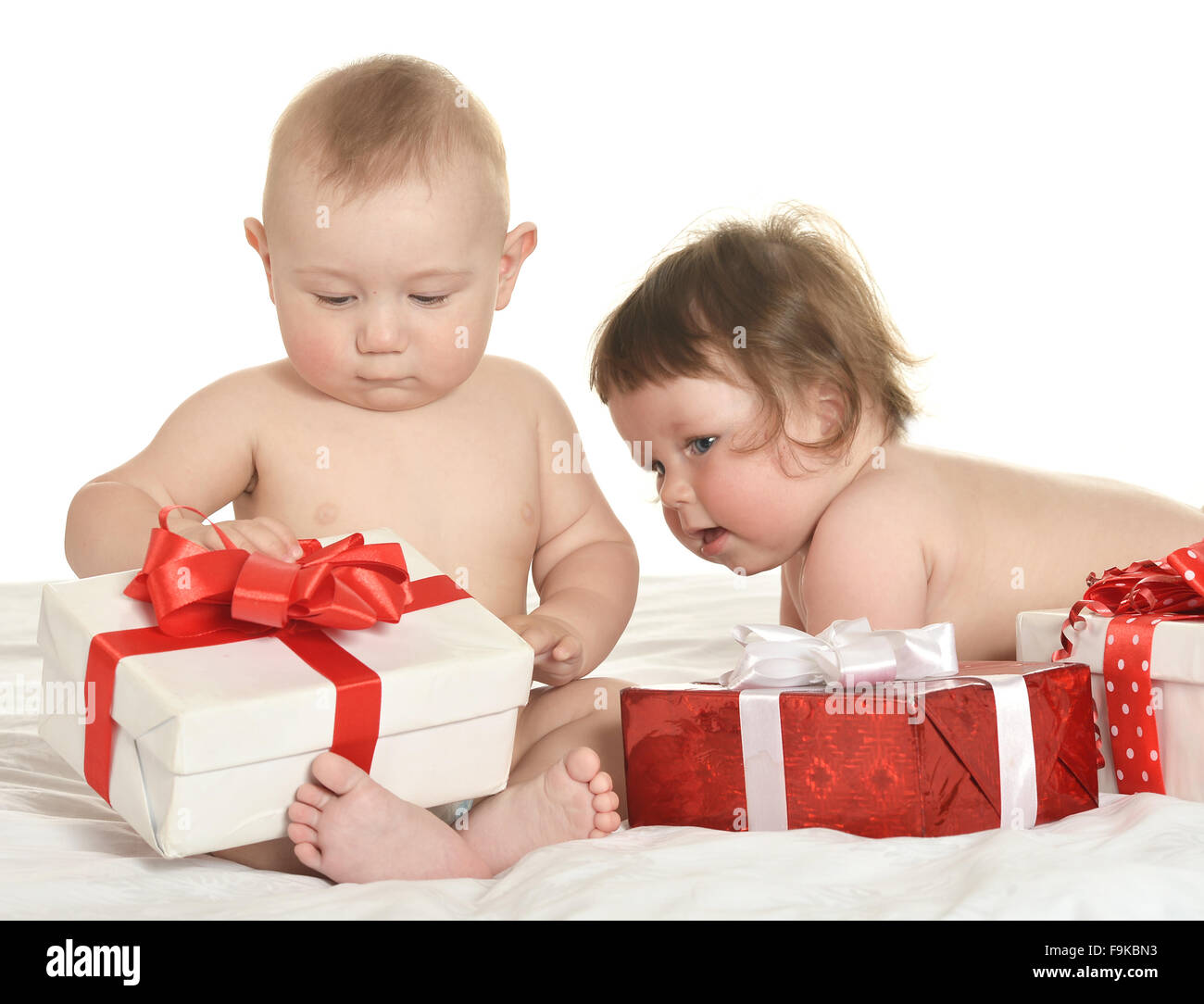 Adorable babies with gifts Stock Photo - Alamy