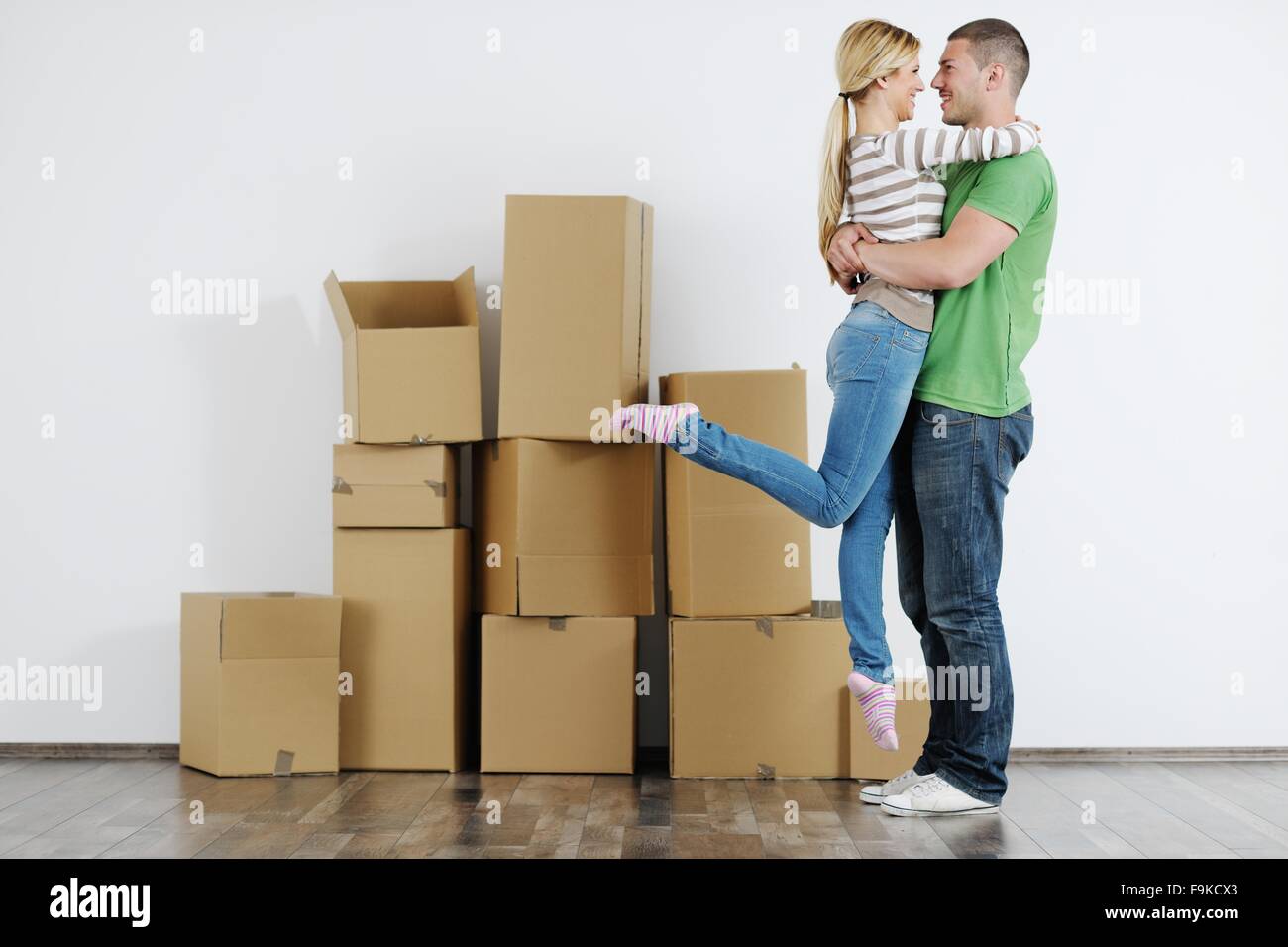 happy Young couple moving in new house Stock Photo - Alamy