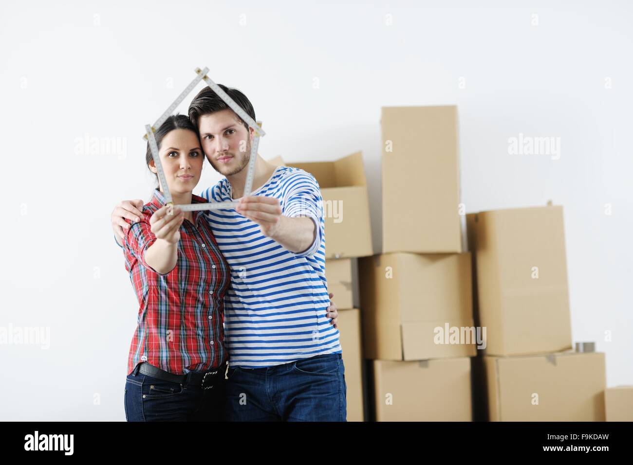 happy Young couple moving in new house Stock Photo - Alamy